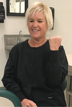 Figure 1: Use the nondominant hand and arm to represent a tooth and its root. Figure 1: Use the nondominant hand and arm to represent a tooth and its root.