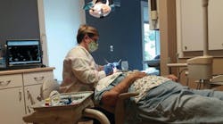 Lisa Costello, RDH, provides preventive services to a patient. Lisa Costello, RDH, provides preventive services to a patient.