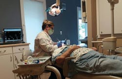 Lisa Costello, RDH, provides preventive services to a patient. Lisa Costello, RDH, provides preventive services to a patient.