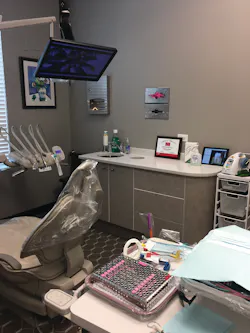 We have a large monitor above each patient chair for naturescape movies, Netflix, or DVDs, and we offer noise cancelling headsets. In the corner notice a painting by a local artist. We have quite the gallery and patients often purchase art right off our walls.