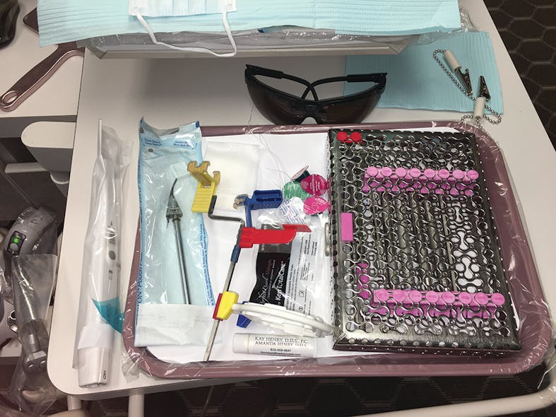 Tray setups include dark patient safety glasses, an intraoral camera, a sterile cassette of instruments, a prophy jet tip, a disposable prophy angle and several prophy paste flavors, and fluoride varnish. We use the Rinn system for all radiographs, and offer aprons with thyroid shields for patients&rsquo; peace of mind.
