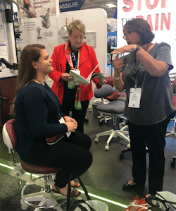 Figure 3: Cindy Purdy, RDH, CEAS, is giving Erin&rsquo;s coworker a lesson on safe ergonomic seating options for dental assistants.