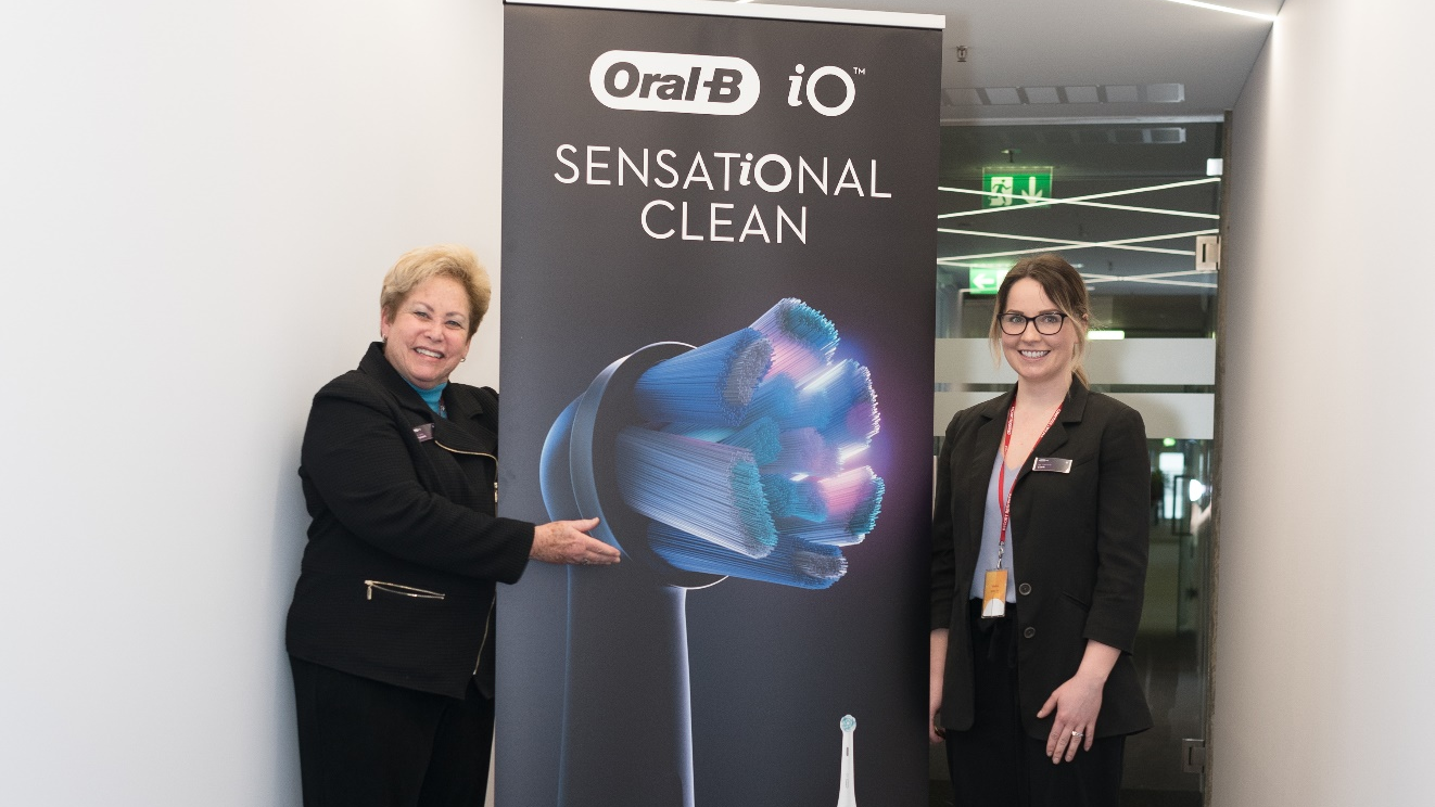 Danielle Clark-Perry, MSc, RDH, and her colleague, Jane L. Forrest, EdD, RDH, pose at the prelaunch of the Oral-B iO toothbrush in Germany.
