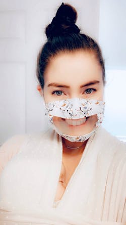 The author's daughter, a speech therapist, wearing a clear mask to facilitate communication. The author's daughter, a speech therapist, wearing a clear mask to facilitate communication.