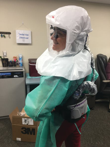 The author wearing her air-purifying respirator.