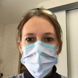 Front view of the author wearing her Cosmo face mask. Front view of the author wearing her Cosmo face mask.