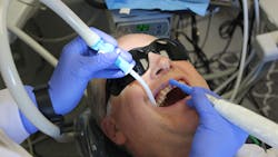 Hill polishing with the Young Infinity handpiece, using the Dove Aero® HVE saliva ejector - large barb connection. It’s disposable and offers additional aerosol control. Hill polishing with the Young Infinity handpiece, using the Dove Aero® HVE saliva ejector - large barb connection. It’s disposable and offers additional aerosol control.