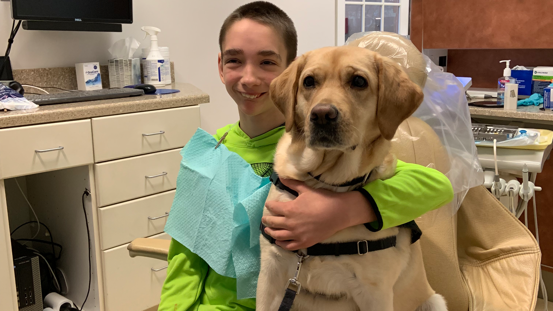 Dylan sitting in the dental chair with Atkins