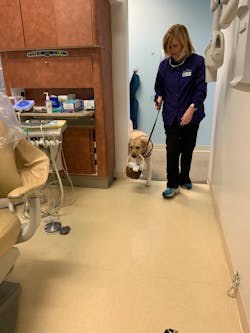Barb leads Atkins into the operatory carrying the toothbrush basket Barb leads Atkins into the operatory carrying the toothbrush basket