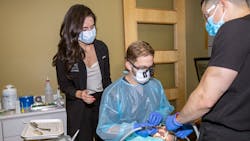 Stephanie Botts shares ergonomic tips with a hygienist. Stephanie Botts shares ergonomic tips with a hygienist.