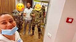 Serhii Prozheiko at his dental office in Kyiv with Ukrainian servicemen.