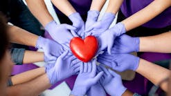 Heart In Gloved Hands