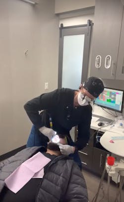 Figure 1: Suction in one hand, power scaler in the other Figure 1: Suction in one hand, power scaler in the other