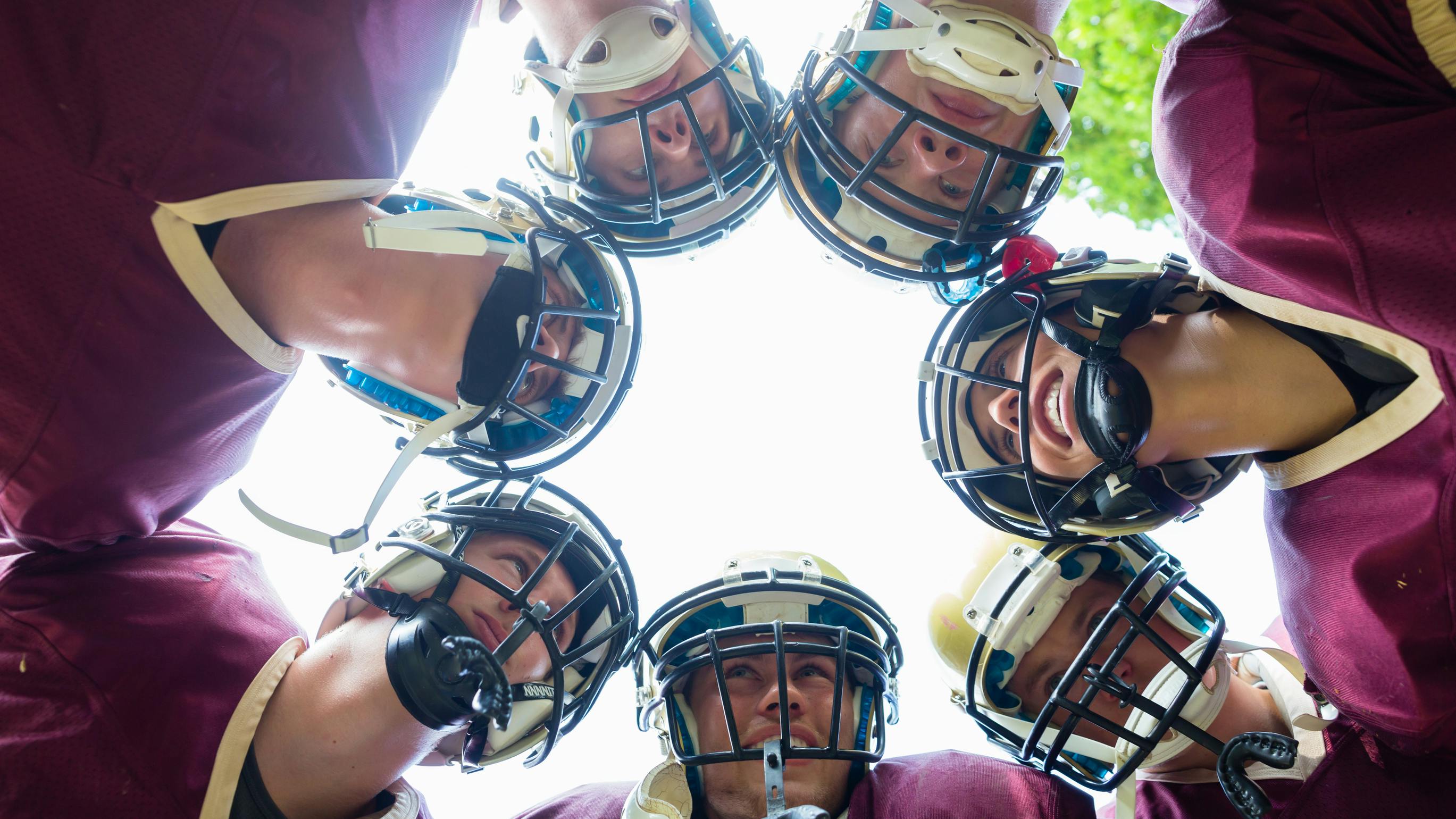 Football players huddling