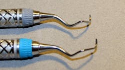 Figure 1: Instrument balance—the top instrument shows an unbalanced, retipped curette; the bottom, a new balanced curette. Figure 1: Instrument balance—the top instrument shows an unbalanced, retipped curette; the bottom, a new balanced curette.