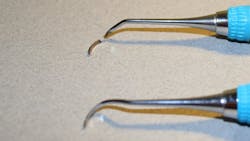 Figure 2: Security of the working end—The top instrument shows a retipped NEVI39 that had an invisible crack. The tip broke when adapted to the typodont. The bottom instrument is a new NEVI39. Figure 2: Security of the working end—The top instrument shows a retipped NEVI39 that had an invisible crack. The tip broke when adapted to the typodont. The bottom instrument is a new NEVI39.