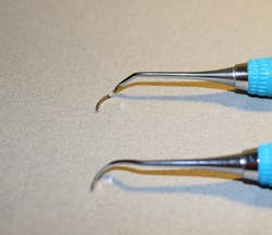 Figure 2: Security of working end. The top instrument shows a retipped NEVI39 that had an invisible crack that broke when adapted it to the typodont. The bottom instrument is a new NEVI39. Figure 2: Security of working end. The top instrument shows a retipped NEVI39 that had an invisible crack that broke when adapted it to the typodont. The bottom instrument is a new NEVI39.
