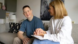 A dental hygienist with a special needs patient A dental hygienist with a special needs patient