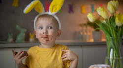 Child eating Easter candy with high sugar content Child eating Easter candy with high sugar content