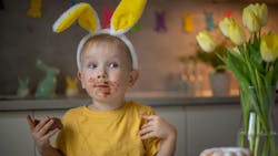 Child eating Easter candy with high sugar content Child eating Easter candy with high sugar content