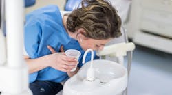 Patient using oral mouth rinse Patient using oral mouth rinse