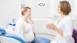hygienist talking to a patient hygienist talking to a patient