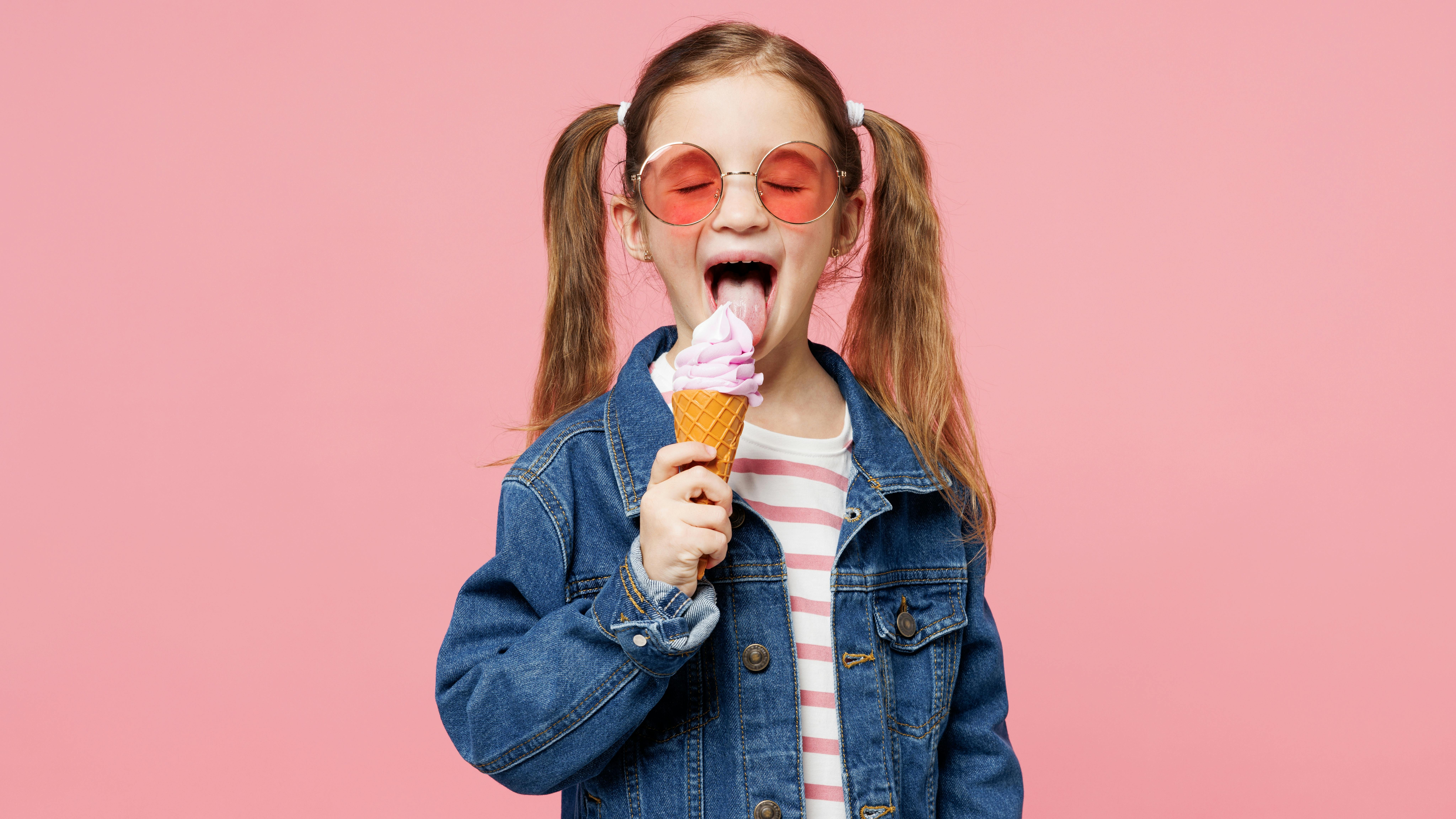 girl licking an ice cream cone