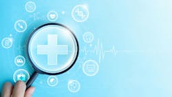 person holding a magnifying glass to focus on health-related graphics person holding a magnifying glass to focus on health-related graphics