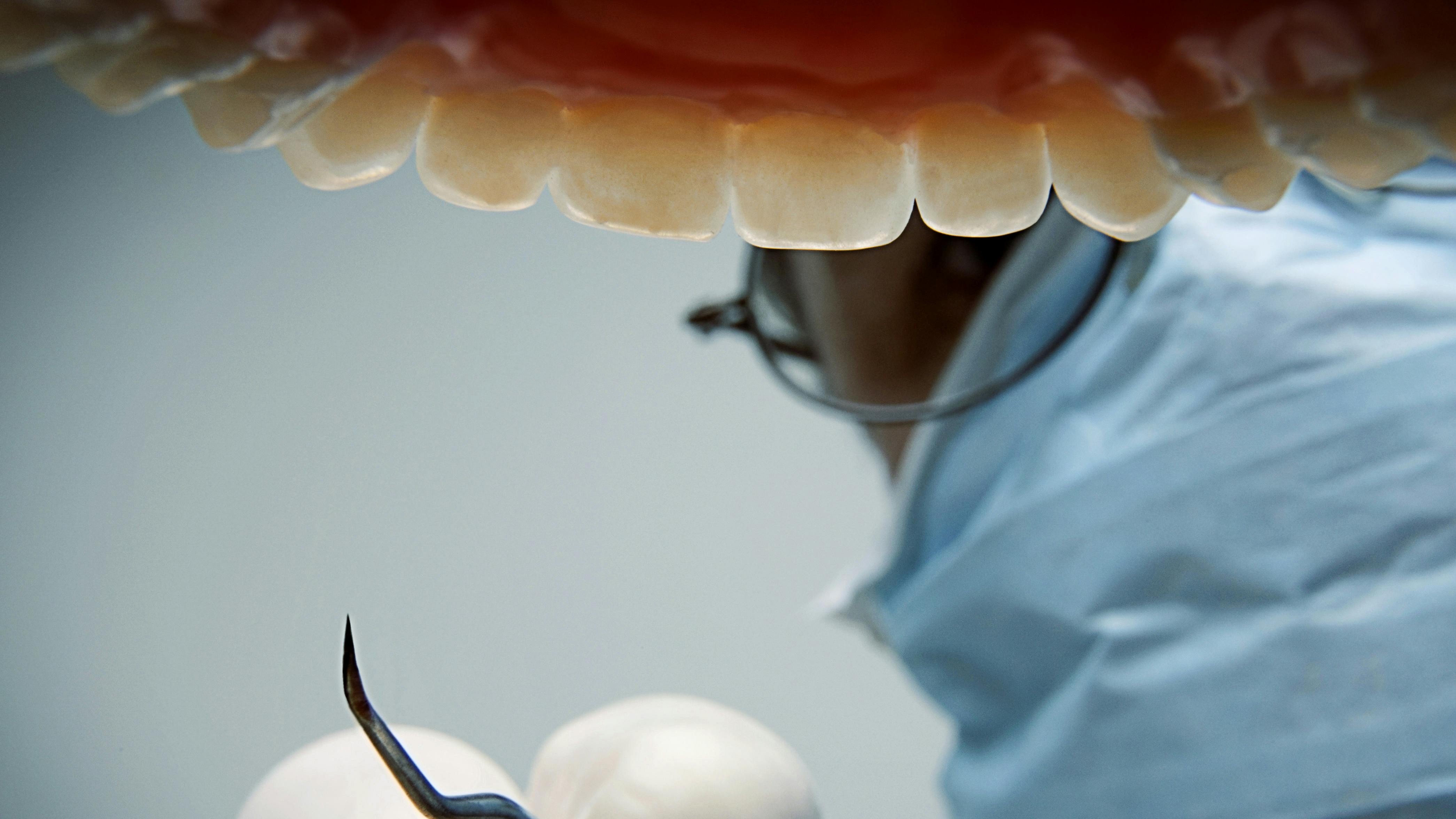 Inside of mouth being treated by hygienist