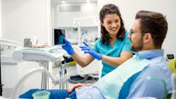dental hygienist communicating with a dental patient dental hygienist communicating with a dental patient