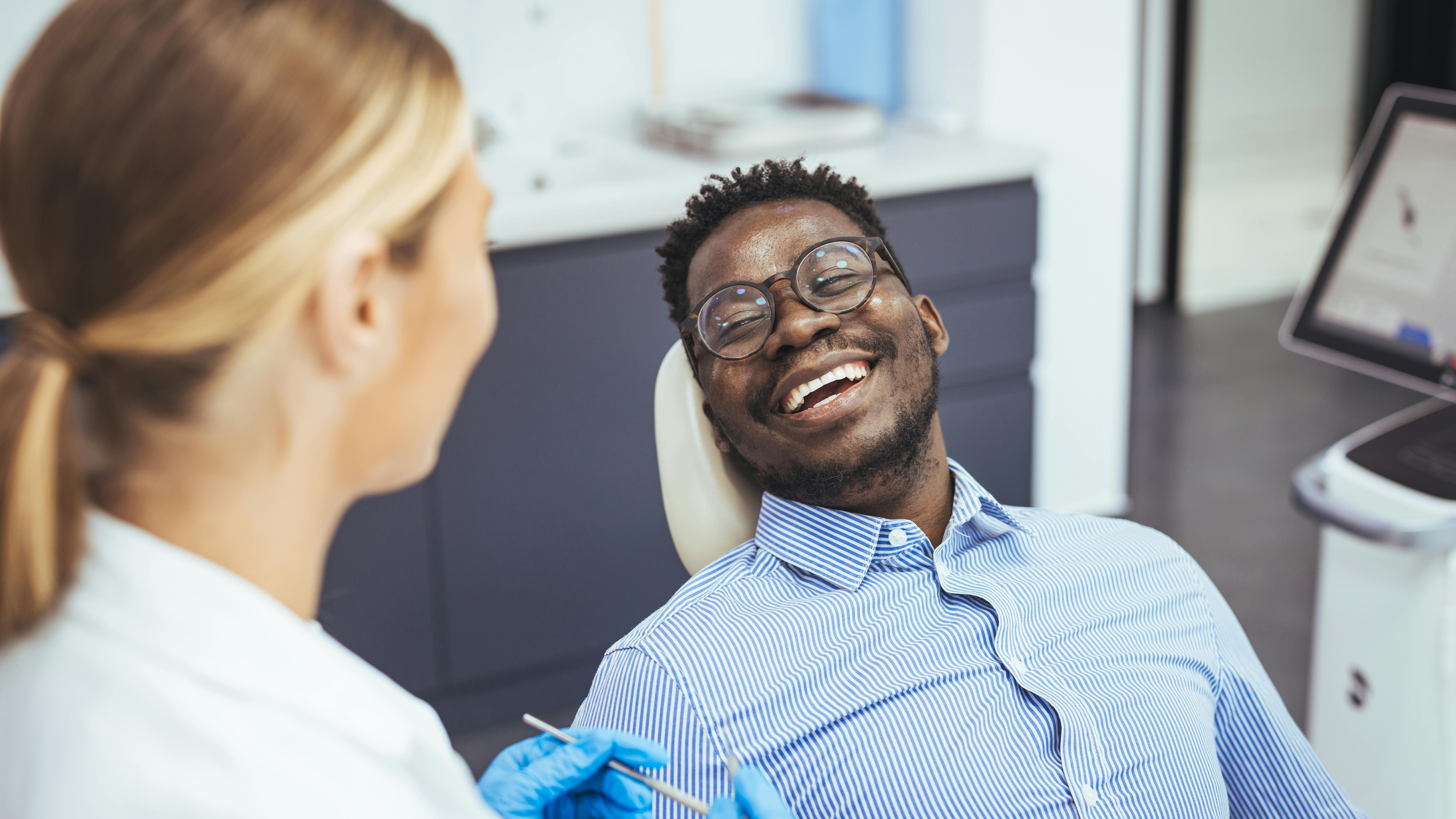 Hygienist with dental patient