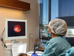 Figure 3: Marvelyn Navarro using the periodontal endoscope with magneto ultrasonics