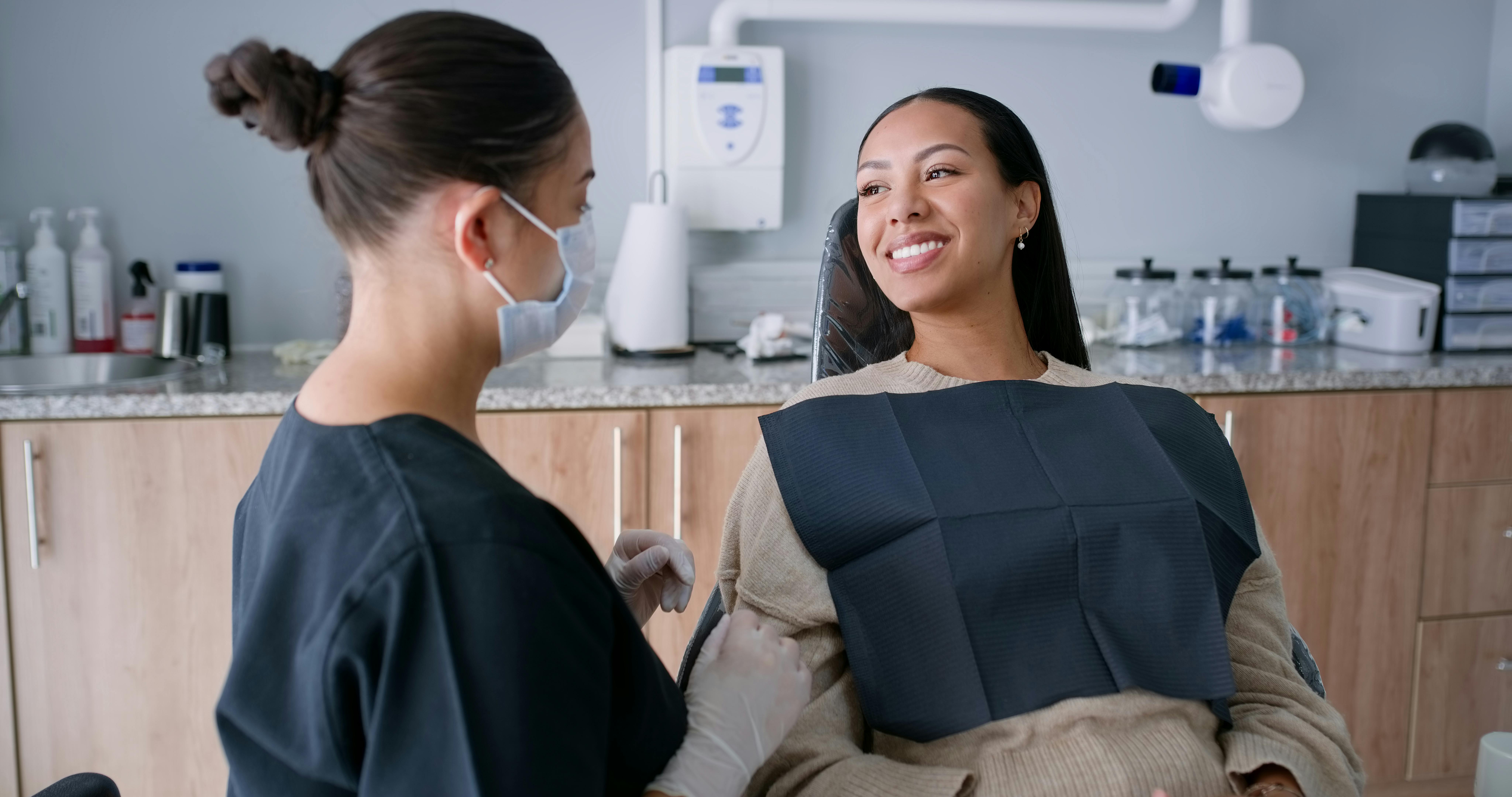 dental hygienist talking to a patient