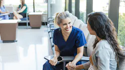 a dental hygienist speaking with a patient a dental hygienist speaking with a patient