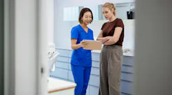 Licensed Dental Hygienist Reviewing Patient Medical History Licensed Dental Hygienist Reviewing Patient Medical History