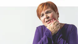 woman holding her face due to dental pain woman holding her face due to dental pain