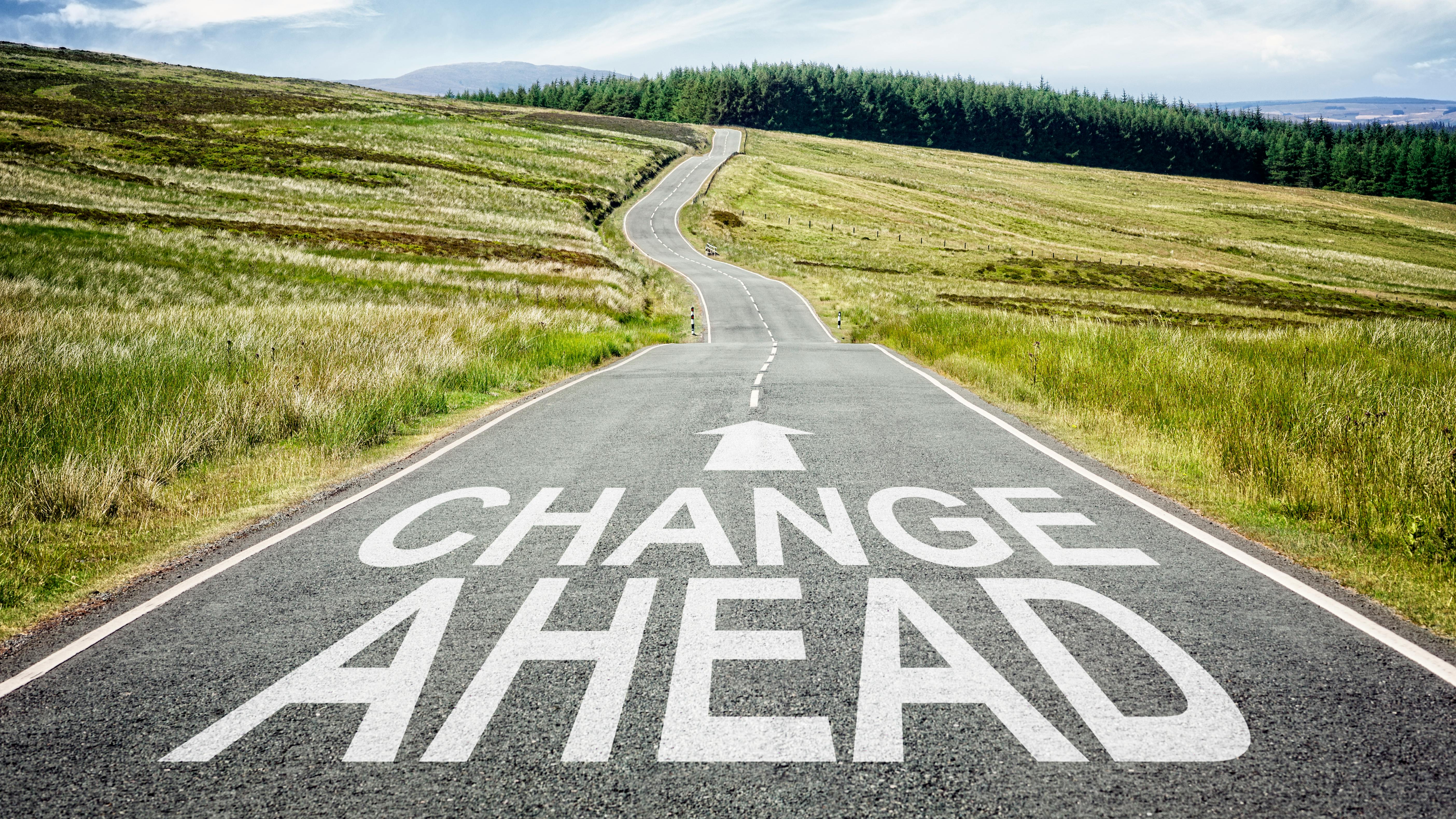 a road that says 'change ahead'