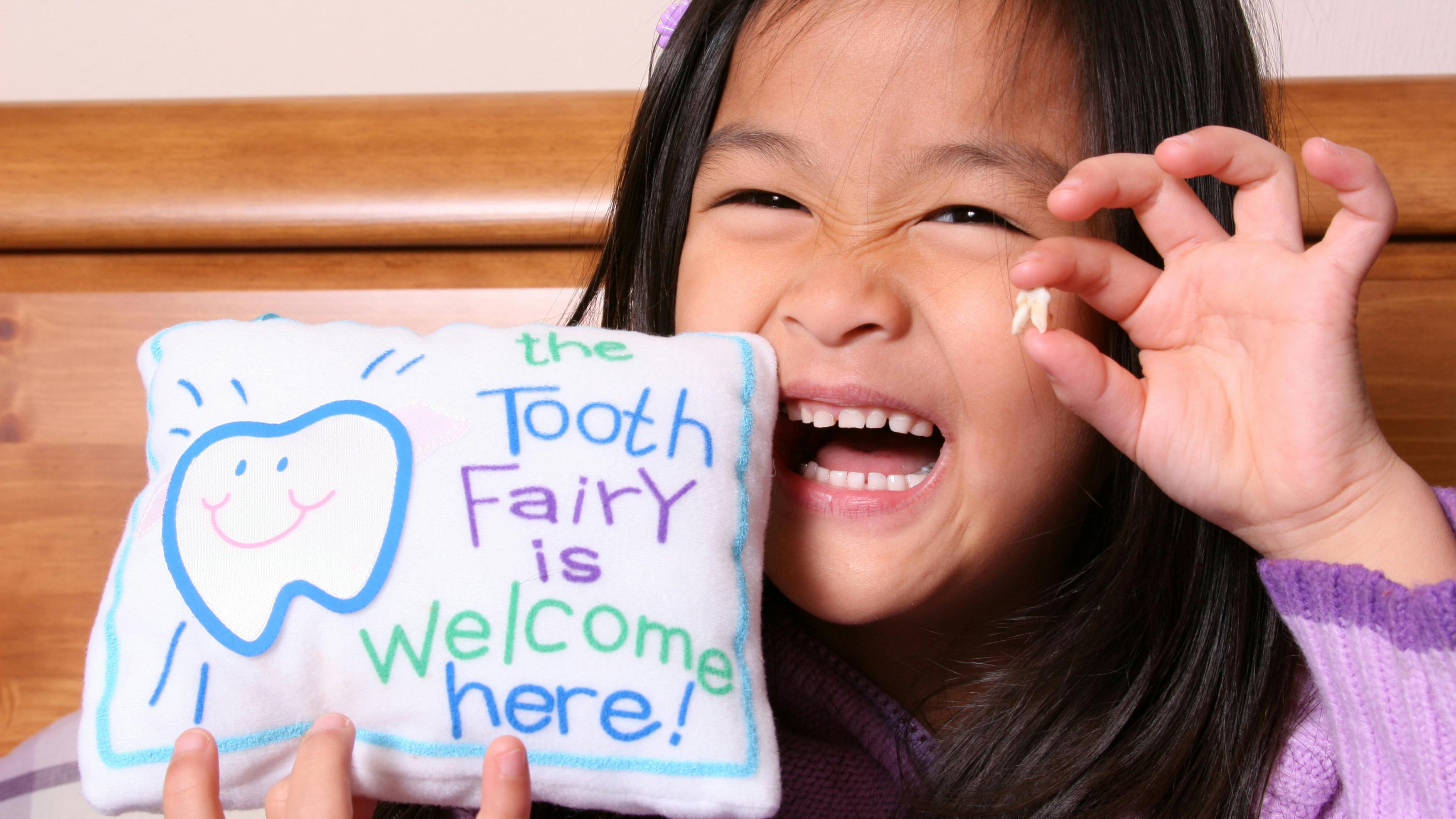 Child with tooth fairy pillow
