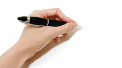 Left hand holding a pen
