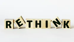 blocks spelling 'rethink' with the e and the n sideways